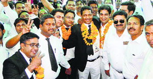 Raj Kumar Chauhan (centre) celebrates after being elected president of the District Bar Association in Karnal on Thursday.