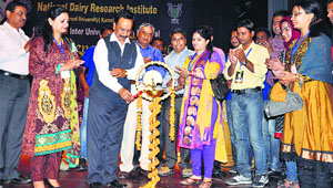 Dr AK Srivastava, Director and Vice-Chancellor of the NDRI, inaugurates the festival by lighting the ceremonial lamp in Karnal on Thursday.