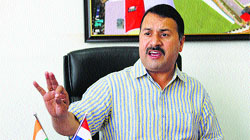 HPCA spokesperson Sanjay Sharma addresses a press conference at the HPCA stadiun campus in Dharamsala on Thursday.