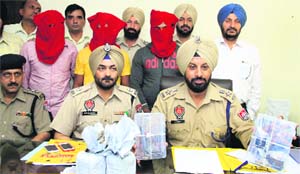 Jalandhar rural police officials show the weapons recovered from the accused in Jalandhar on Thursday