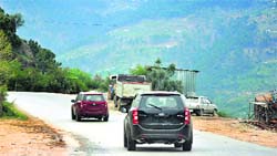 Vehicles without registration number plates ply on the Jammu-Srinagar highway. Tribune photo: Inderjeet Singh