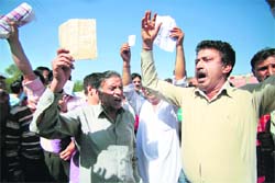 Kashmiri Pandits at Jagti hold protest after they did not find their names in the voter list for the Anantnag parliamentary seat on Thursday. Tribune photo: Anand Sharma