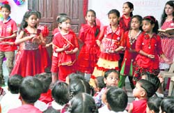 Students of May Fair Higher Secondary School perform during the celebration of Red Day in Jammu. A Tribune photograph