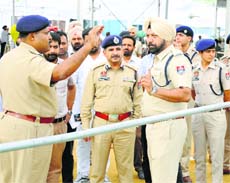 Police officials discuss security arrangements ahead of Narendra Modi's rally in Ludhiana.
