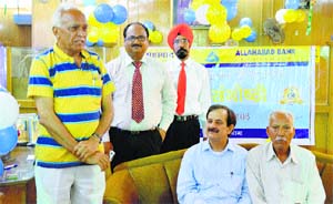 An old customer shares his experience on the 150th Foundation Day of Allahabad Bank in Ludhiana on Thursday. 