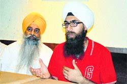 Amarbeer Singh Gill (right) interacts with mediapersons in Ludhiana