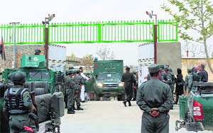 An ambulance carrying victims of a shooting leaves Cure International hospital in Kabul on Thursday. 