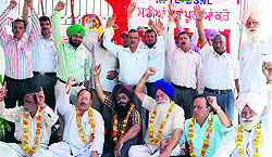Telecom employees stage a dharna in Amritsar on Friday
