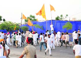 All for poll: Party workers take away SAD flag from the venue of Narendra Modis rally in Bathinda on Friday