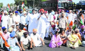 Protesters block a road during a protest in Kharar on Friday