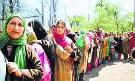 Women in south Kashmirs Anantnag constituency queue up to cast their vote on Thursday