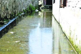 A waterlogged bylane in Magarmal Bagh near Lal Chowk in Srinagar