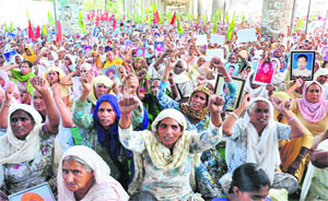 Members of the BKU should slogans against the Central and state governments in Bathinda on Saturday.