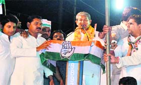 ACTIVE CAMPAIGNING: Chief Minister Harish Rawat addresses a public meeting at Jwalapur in Haridwar on Saturday