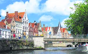 A boat tour through the meandering canals of Bruges is the best way to see the city