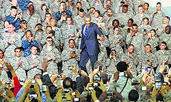US President Barack Obama is greeted by US military personnel upon his arrival to deliver a speech at US military base Yongsan Garrison in Seoul on Saturday