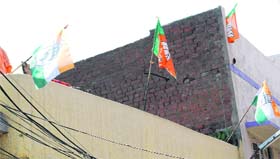flags of the Congress and the BJP on a building in the city indicate the tough electoral battle in Amritsar