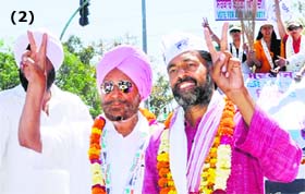 AAP leader Yogendra Yadav (right) holds a road show in support of Dr Daljit Singh in Amritsar on Sunday