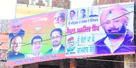 Hoardings of Captain Amarinder Singh and Arun Jaitley hang side-by-side on a private under-construction building