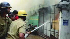 Firefighters douse the flames after a fire breaks out in a lawyer's chamber on the Supreme Court premises in New Delhi on Sunday.
