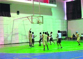 A match in progress during the All-India Golden Jubilee Basketball Tournament in Dehradun on Sunday