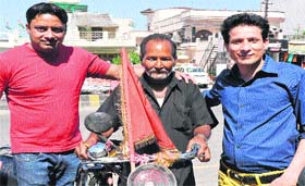 Rajendra Gupta, a pilgrim from Punjab who has undertaken pilgrimage to all major religious shrines on his bicycle, in Haridwar on Friday