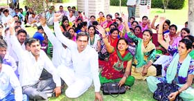 Seeking wages: Computer teachers working in government schools on a contract basis in Hisar protest against non-payment of their salaries of the past many months