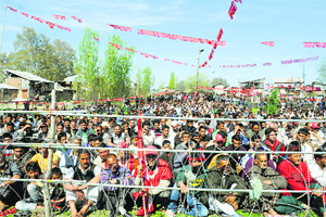 National Conference supporters listen to party candidate for the Srinagar constituency Farooq Abdullah at a rally in Budgam district on Sunday. 