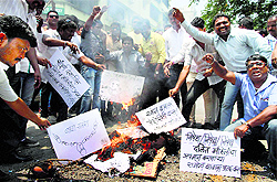 Congress and NCP workers protest against Ramdevs remark on Dalits in Thane on Sunday