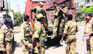Jawans of paramilitary forces alight from a truck in Amritsar on Monday.