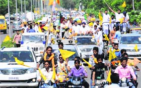 Supporters of SAD candidate Prof Prem Singh Chandumajra organise a roadshow in Mohali on Monday