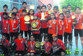 Winners pose with their medals and trophies in Panchkula on Monday