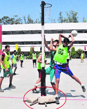 A player tries to score a goal during a match at Sector 7 in Chandigarh on Monday