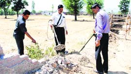 Gujarat and Uttarakhand police personnel carry out a security check at the rally venue at Herbertpur, Dehradun, on Monday.