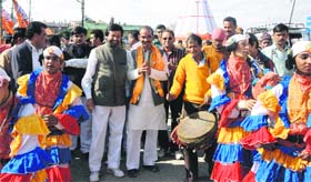 BJPs Almora candidate Ajay Tamta during a roadshow in Pithoragarh on Monday. Traditional Cholia dancers are also seen in the picture.