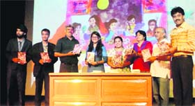 Dignitaries release Shamita Harshs maiden book during the youth festival organised at Tulas Institute in Dehradun on Monday.