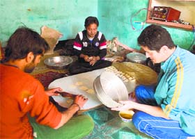 Tibetan refugees make momos at their restaurant in Srinagar