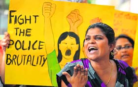 An activist shouts slogans condemning alleged police brutality against sex workers during a protest organised by non-governmental organisations working in support of sexual minorities in Bangalore on Monday.