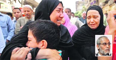 Egyptians react outside the courtroom in Egypt's southern province of Minya after a court sentenced Muslim Brotherhood leader Mohamed Badie (inset) and other alleged Islamists to death on Monday.