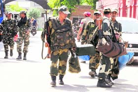 Paramilitary forces and Punjab police personnel leaving for election duty in Amritsar on Tuesday