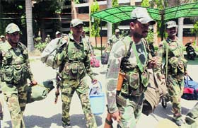 Members of the paramilitary force leave for poll duty at Government Polytechnic College in Bathinda on Tuesday.