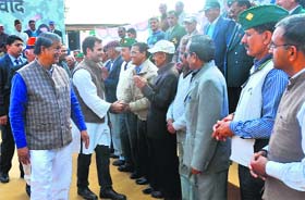 Congress vice-president Rahul Gandhi meets ex-servicemen during a visit to Dehradun in February 2014