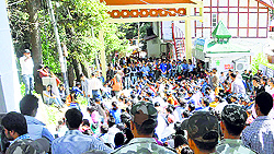Activists of the SFI block the main gate of Himachal Pradesh University during a rally on Tuesday