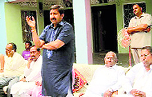 Industry Minister Mukesh Agnihotri addresses an election meeting at the Haroli segment in Una on Tuesday