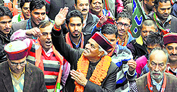 BJP Lok Sabha candidate Virender Kashyap with his supporters after filing his nomination papers at the DCs office in Shimla