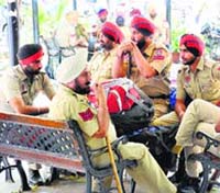 Policemen on duty outside a polling booth in Jalandhar on Tuesday.