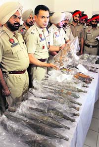 The police show weapons recovered from Ludhiana on Tuesday.