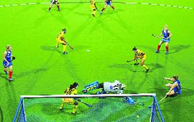 A Scotland player (extreme right) deflects in a goal during their 4-0 win over India in the Champions Challenge 1 in Glasgow on Monday.