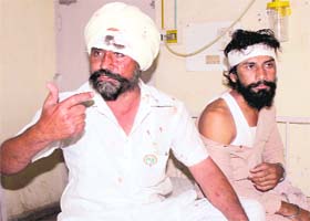 Injured Congress workers from Lehra Mohabat at the Civil Hospital in Bathinda on Wednesday