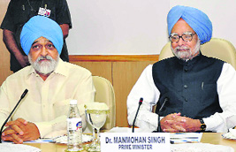 Prime Minister Manmohan Singh and Planning Commission Deputy Chairman Montek Singh Ahluwalia during a plan panel meet in New Delhi on Wednesday. 